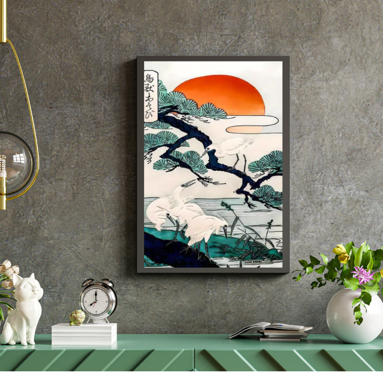 Framed artwork of a Japanese landscape with a sunset on a gray wall above a green shelf.